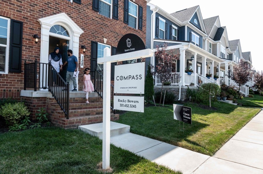 Prospective home buyers leave a property for sale during an Open House in a neighborhood in Clarksburg, Maryland on September 3, 2023. Homeownership feels increasingly out of reach for younger generations of Americans, who are squeezed by student debt and childcare costs in an era of slower economic growth. (Photo by ROBERTO SCHMIDT / AFP)