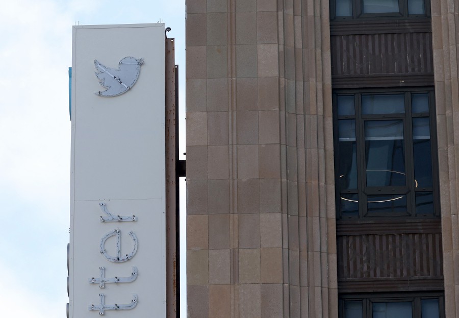 The outline of the iconic blue Twitter bird logo is visible on a sign in front of X headquarters on July 26, 2023 in San Francisco, California. A day after San Francisco police officers halted the dismantling of the Twitter sign at Twitter headquarters, one of the blue birds has disappeared along with three of the letters. CEO Elon Musk officially rebranded Twitter as "X" and has changed its bird logo, the biggest change he has made since taking over the social media platform. -AFP PIC
