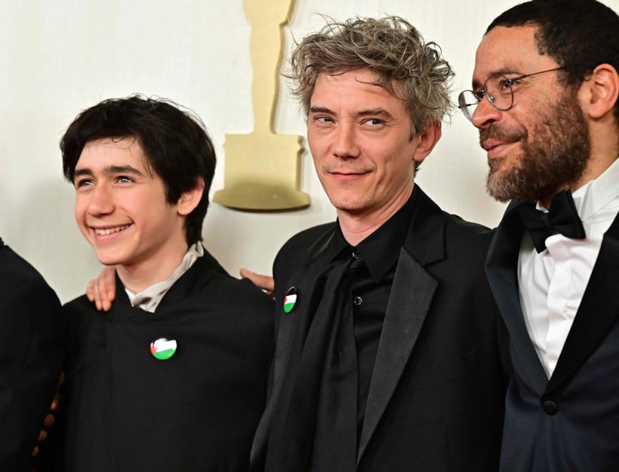 French actor Milo Machado-Graner (2nd L) and French actor Swann Arlaud (2nd R), wearing a Palestinian flag pin, attend the 96th Annual Academy Awards at the Dolby Theatre in Hollywood, California on March 10, 2024. AFP PIC