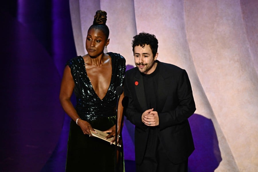 US actress Issa Rae (L) and US comedian Ramy Youssef present the award for Best Live Action Short Film onstage during the 96th Annual Academy Awards at the Dolby Theatre in Hollywood, California on March 10, 2024. AFP PIC