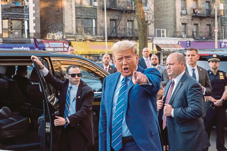 Trump visited the bodega after spending a second day in court where he faces 34 felony counts of falsifying business records in the first of his criminal cases to go to trial. (Photo by SPENCER PLATT / GETTY IMAGES NORTH AMERICA / Getty Images via AFP)
