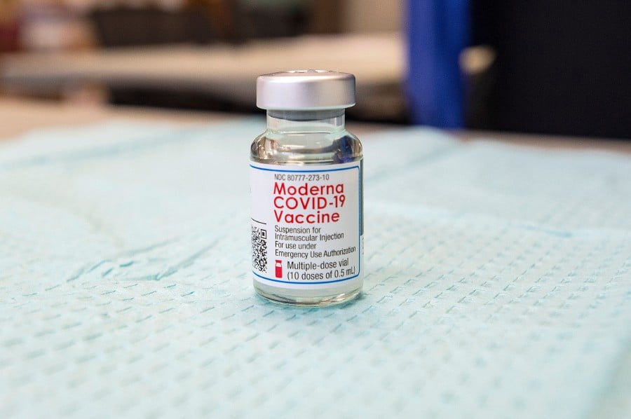 A vile of Moderna Vaccine sits on a counter waiting for nurses to daw from it at Hartford HealthCare at Home in Bloomfield, Connecticut on February 12, 2021. - The head of the EU’s disease control agency warned on Friday that the novel coronavirus could last indefinitely even as global infections slowed by nearly half in the last month and vaccine rollouts gathered pace in parts of the world. (Photo by Joseph Prezioso / AFP)
