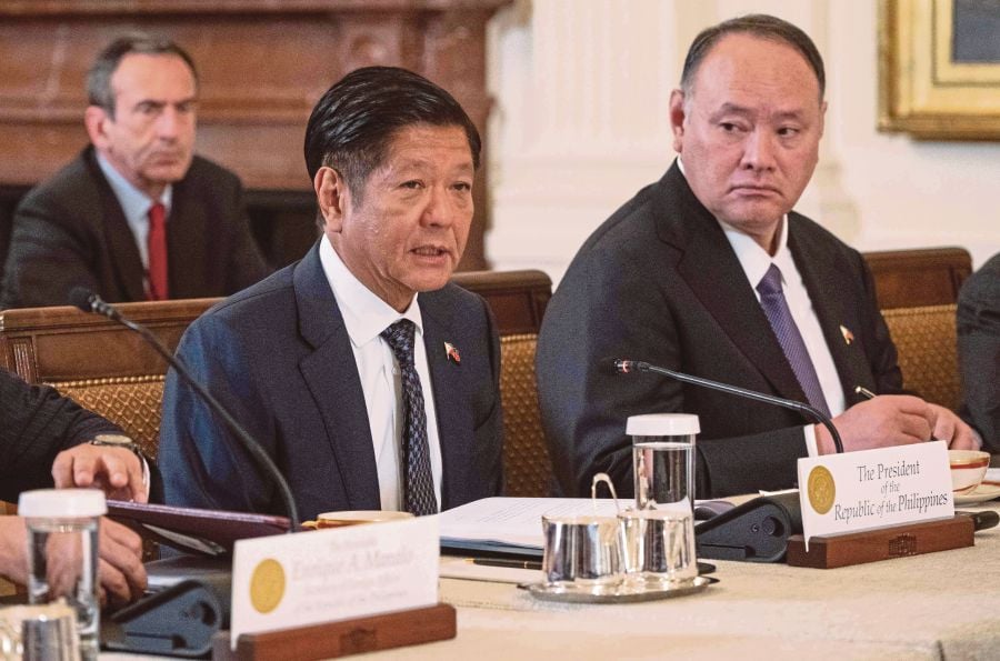 Filipino President Ferdinand Marcos Jr. (left) speaks during a trilateral meeting with US President Joe Biden and Japanese Prime Minister Fumio Kishida (off frame) in the East Room of the White House in Washington, Dc. (Photo by ANDREW CABALLERO-REYNOLDS / AFP)