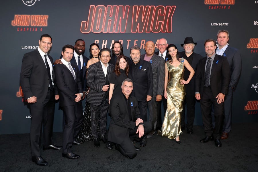 HOLLYWOOD, CALIFORNIA - MARCH 20: (L-R) Scott Adkins, Marko Zaror, Shamier Anderson, Rina Sawayama, Hiroyuki Sanada, Keanu Reeves, Erica Lee, Chad Stahelski, Ian McShane, Laurence Fishburne, Joe Drake, Natalia Tena, Clancy Brown, David Leitch, and Basil Iwanyk attend the Los Angeles Premiere of Lionsgate's "John Wick: Chapter 4" at TCL Chinese Theatre on March 20, 2023 in Hollywood, California. - AFP pic