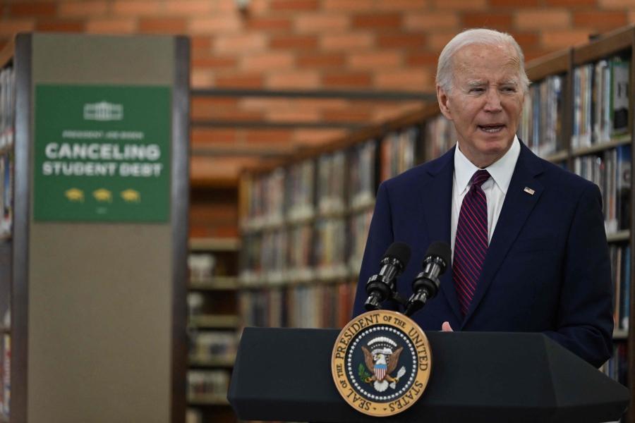 US President Joe Biden speaks during an event to announce that his Administration has approved 1.2 billion in student debt cancellation for almost 153,000 borrowers at the Julian Dixon Library in Culver City, California. (Photo by ANDREW CABALLERO-REYNOLDS / AFP)