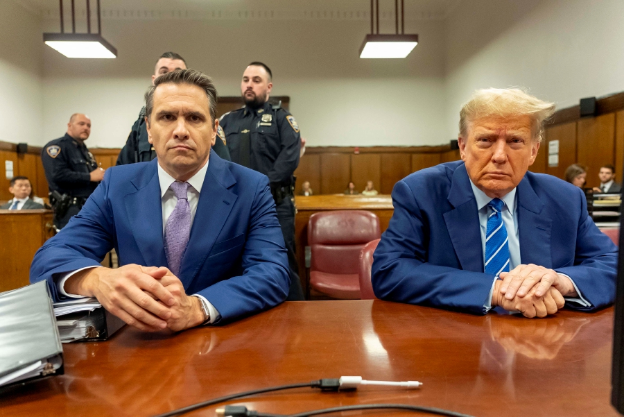 Former US President Donald Trump (right) with his attorney Todd Blanche, attends the second day of his trial for allegedly covering up hush money payments linked to extramarital affairs, at Manhattan Criminal Court in New York City. (Photo by Mark Peterson / POOL / AFP)