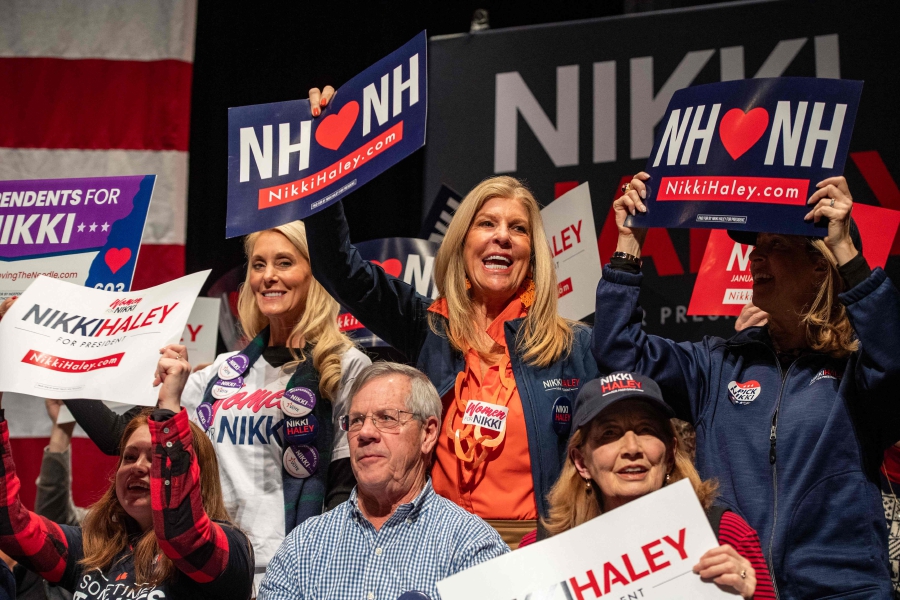 Supporters cheer as Republican presidential hopeful and former UN Ambassador Nikki Haley speaks at a campaign event in Exeter, New Hampshire. (Photo by Joseph Prezioso / AFP)