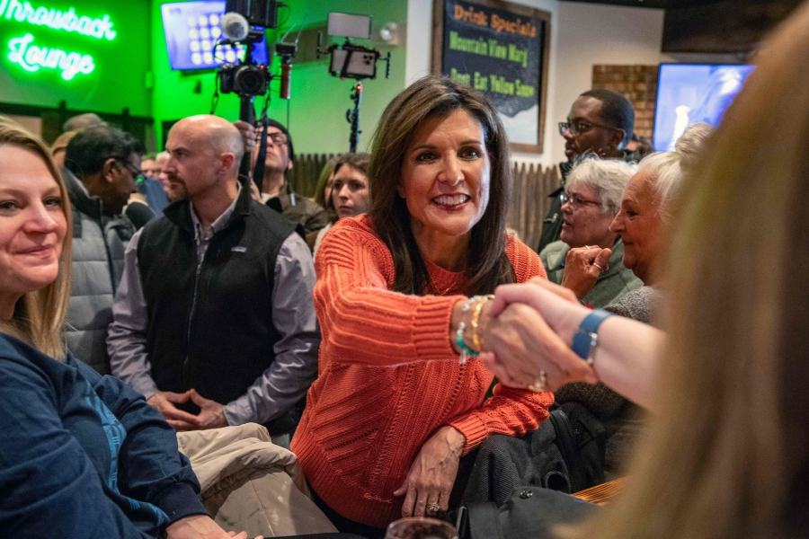 Republican presidential hopeful and former UN Ambassador Nikki Haley greets voters at a campaign event at the Backyard Brewery in Manchester, New Hampshire. (Photo by Joseph Prezioso / AFP)