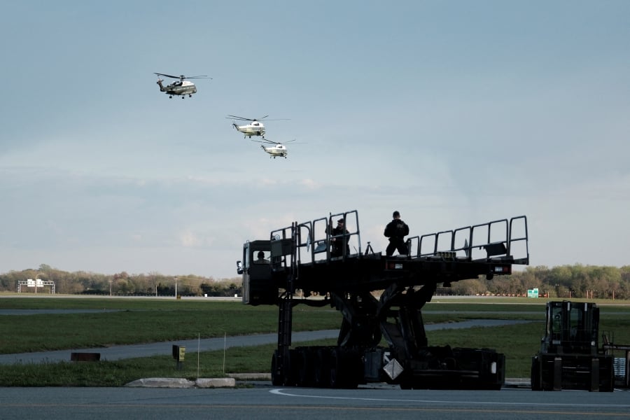 Counter snipers stand guard as U.S. President Joe Biden flies on Marine One in Dover, Delaware, U.S. (REUTERS/Michael A. McCoy)