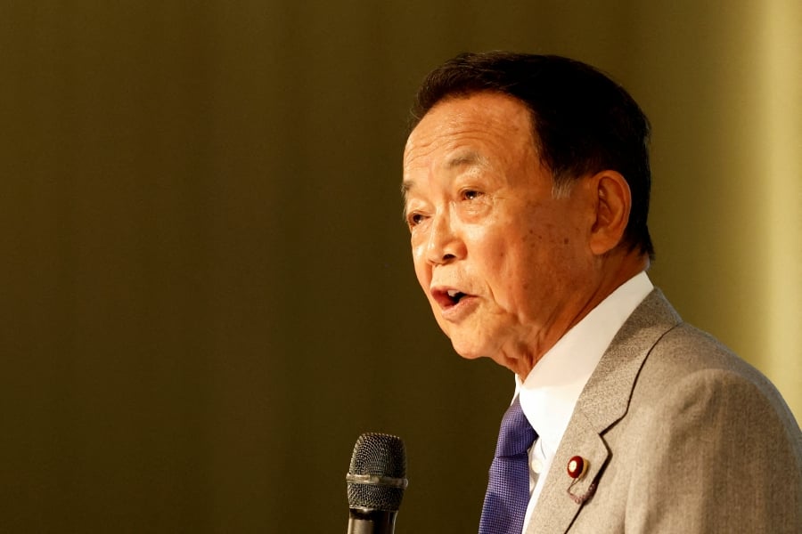 (FILE PHOTO) Japan's former prime minister and current vice vresident of the ruling Liberal Democratic Party, Taro Aso, speaks during the Ketagalan Forum in Taipei, Taiwan. (REUTERS/Carlos Garcia Rawlins/File Photo)