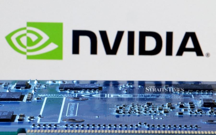NVIDIA logo is seen near computer motherboard in this illustration. REUTERS/Dado Ruvic/Illustration/File Photo