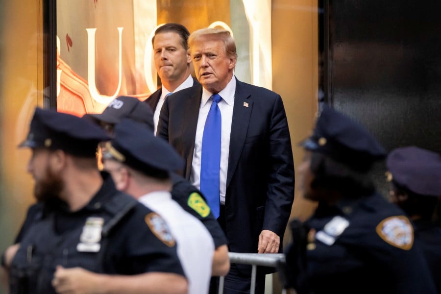 Former US President Donald Trump's looks on following the announcement of the verdict of his criminal trial over charges that he falsified business records to conceal money paid to silence porn star Stormy Daniels in 2016, outside Trump Tower, in New York City, May 30, 2024. REUTERS