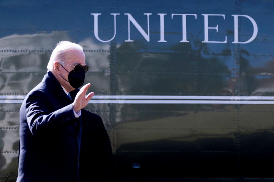 US President Joe Biden waves as he walks past Marine One after arriving on the South Lawn of the White House in Washington, DC, USA, 28 February 2022. Biden returned from Delaware. - EPA pic