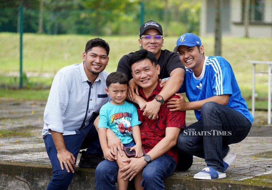 The man, Michael Tong Wai Siong, 55, struck a friendship with the boy, Rafei Ahmad Fauzi, ultimately adopting him and his two brothers Rasyid and Abdul Rahman. - NSTP/EFFENDY RASHID