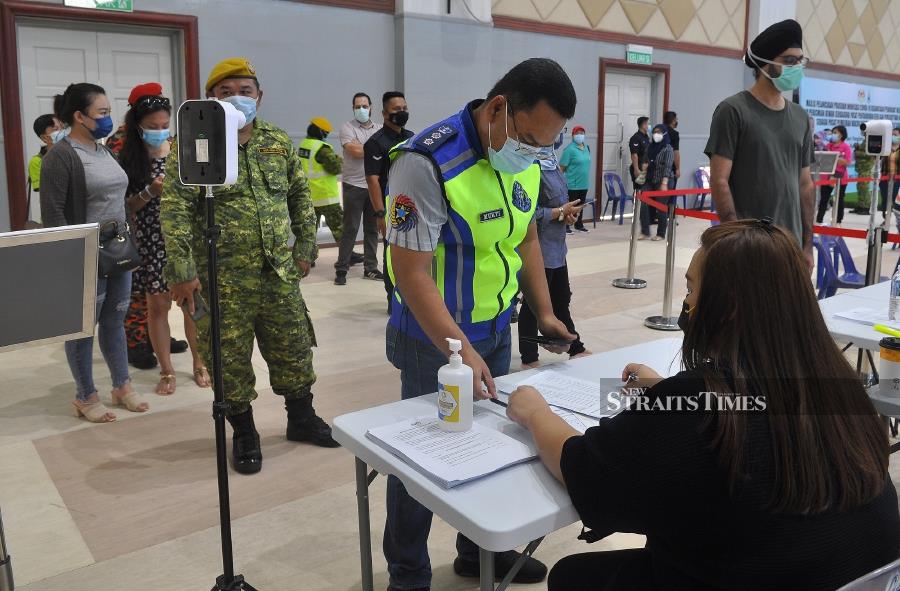 Sabah Covid-19 spokesman Datuk Seri Masidi Manjun said, as today, 28,445 people have been inoculated, including 67.5 per cent of the frontliners in the state. - KHIS/MOHD ADAM ARININ