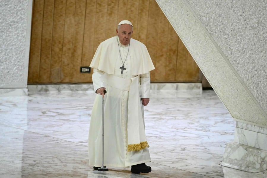 Pope Francis arrives for the weekly general audience at Paul-VI hall in The Vatican. (Photo by Tiziana FABI / AFP)