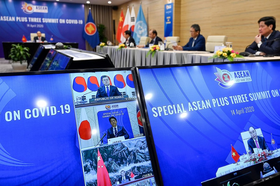 FILE PIX: Vietnam’s Prime Minister Nguyen Xuan Phuc (on the right screen) addresses a live video conference on the special Association of Southeast Asian Nations (Asean) Plus Three Summit on the Covid-19 coronavirus pandemic in Hanoi on April 14, 2020. -- Pix: AFP