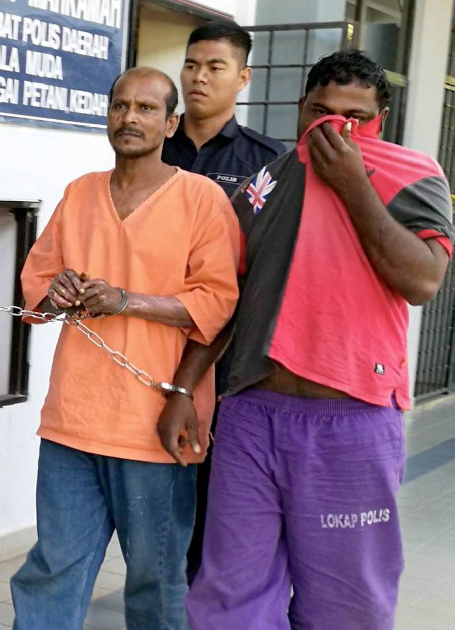 (File pix) V. Mathiyalagan, 46 (left) at the Sungai Petani magistrate’s court. He has been charged under Section 302 of the Penal Code which carries the mandatory death penalty upon conviction. Pix by Omar Osman