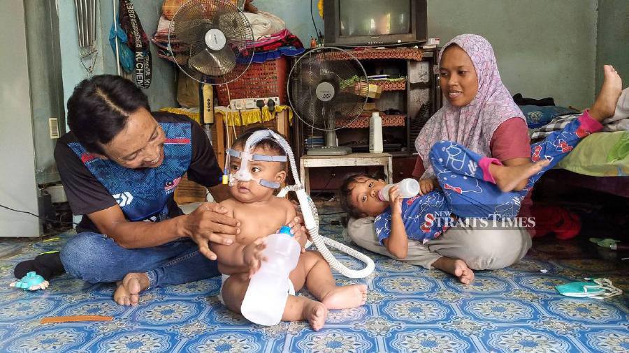 The couple who went viral for riding a motorcycle with their 11-month-old baby, who relies on a Continuous Positive Airway Pressure (CPAP) machine due to chronic lung disease, are believed to have gone missing. NSTP / WAN NABIL NASIR 