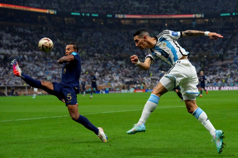Argentina's Angel Di Maria connect a shot during the World Cup final soccer match between Argentina and France at the Lusail Stadium in Lusail, Qatar, Sunday, Dec. 18, 2022. -AP PIC