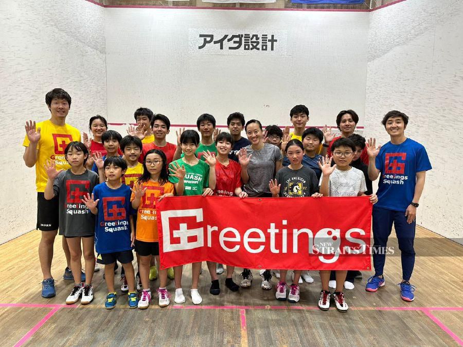 Low Wee Wern (centre) with the Greetings Squash Club juniors in Saitama recently. - NSTP/KNG ZHENG GUAN