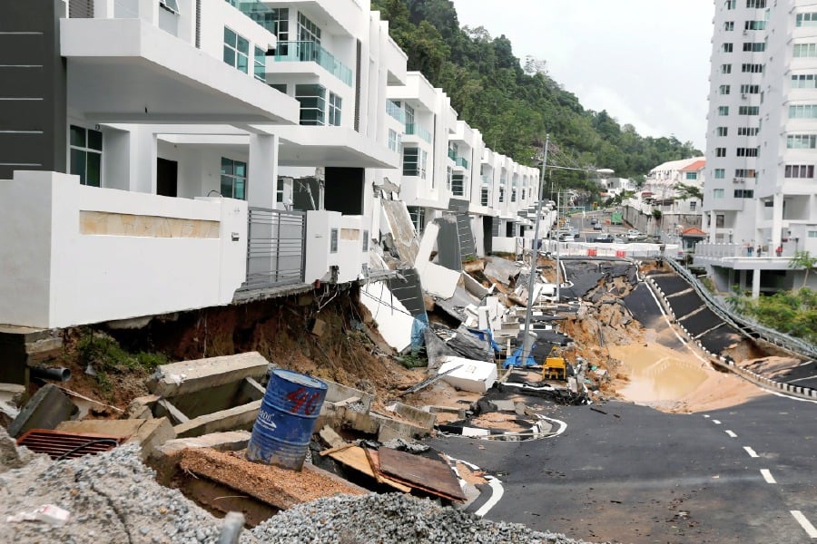 Road leading to Penang housing area on hillslope collapses 