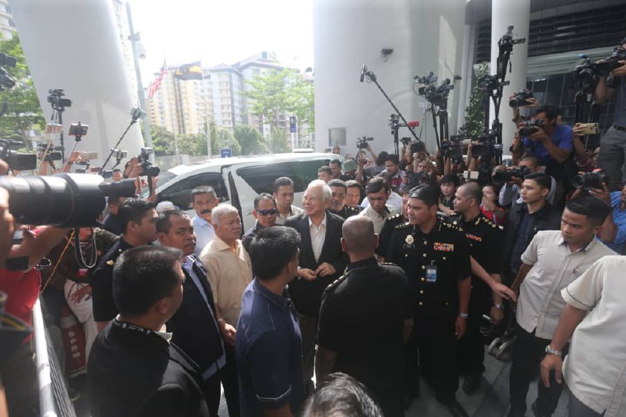 Former prime minister Datuk Seri Najib Razak (centre) arriving at the Malaysian Anti Corruption Commission (MACC) headquarters in Putrajaya. Pix by Mohd Fadli Hamzah