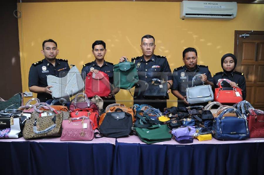 Fake designer handbags worth RM20,000 seized from shopping mall outlets