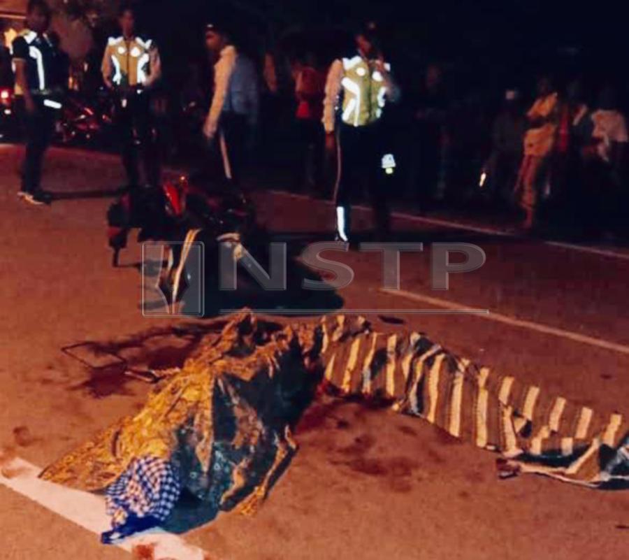 Two teenagers were killed when the motorcycle they were riding collided with an errant cow, causing them to fall into the opposite lane where they were run over by a car near here, last night. Pic by NSTP/Courtesy of NSTP readers