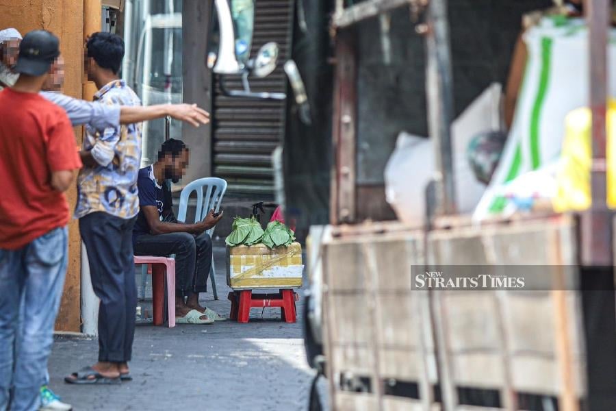 Foreign nationals in Jalan Silang, Lebuh Pudu, and Kota Raya, commonly referred to as 'Mini Dhaka', appear undeterred as they continue to sell their goods despite frequent raids by the authorities. Pic by Ahmad Ukasyah