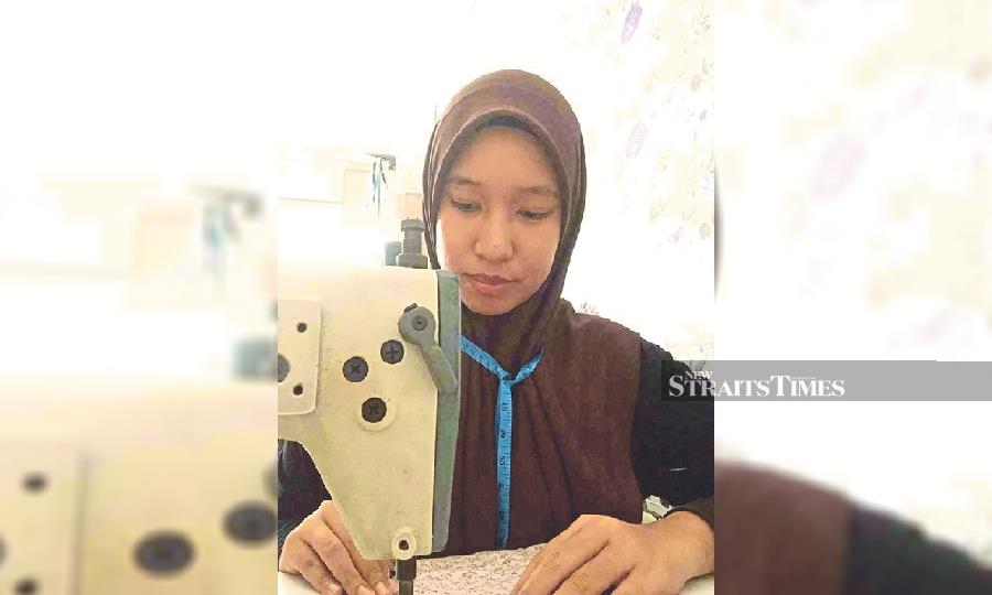 New into the clothing business, tailor Siti Aisyah Kahar received 20 orders for Hari Raya outfits this year.