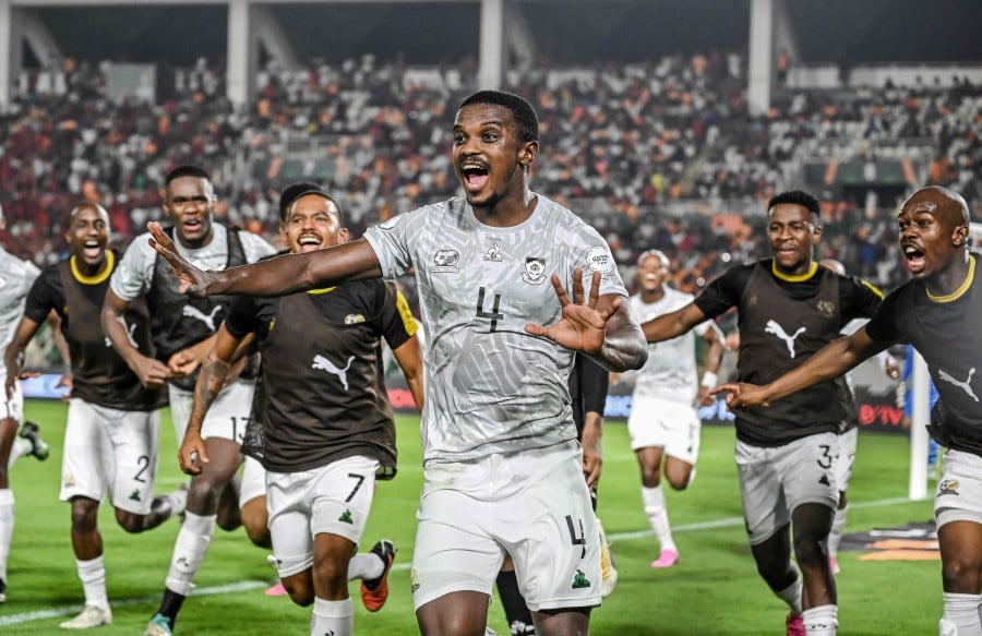 South Africa's midfielder #4 Teboho Mokoena (C) celebrates with teammates after scoring a goal during the Africa Cup of Nations (CAN) 2024 round of 16 football match between Morocco and South Africa on January 30, 2024.- AFP pic