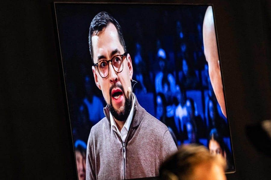 Chairman of Naalakkersuisut in Greenland (Prime Minister) Mute Egede is seen on a screen during the recordings of a TV debate about Greenland's future, in a studio in Copenhagen, Denmark, on Jan 19. - AFP