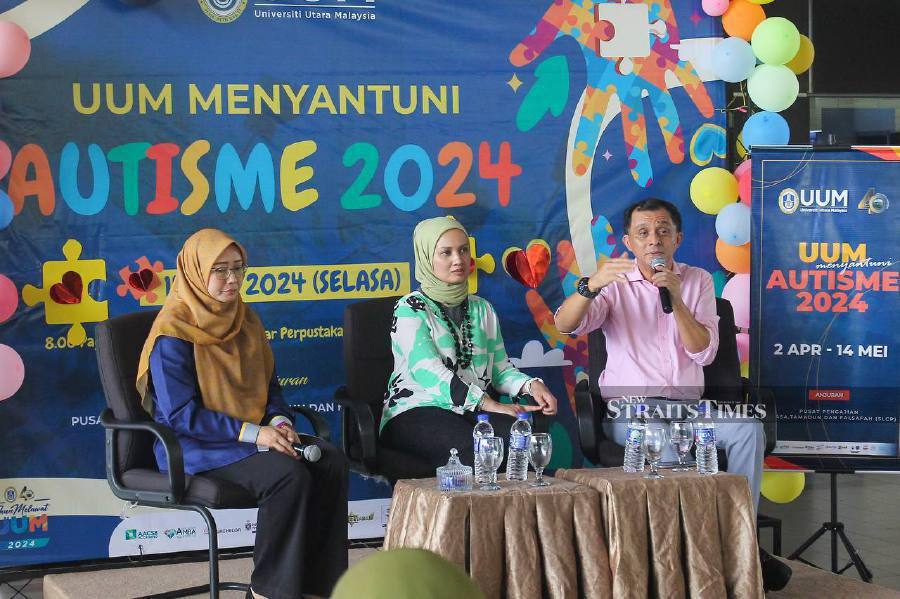 UUM alumni Dr Ahmad Idham Ahmad Nadzri speaking at Menyantuni Autism 2024 programme at Universiti Utara Malaysia yesterday. -- NSTP/ WAN NABIL NASIR