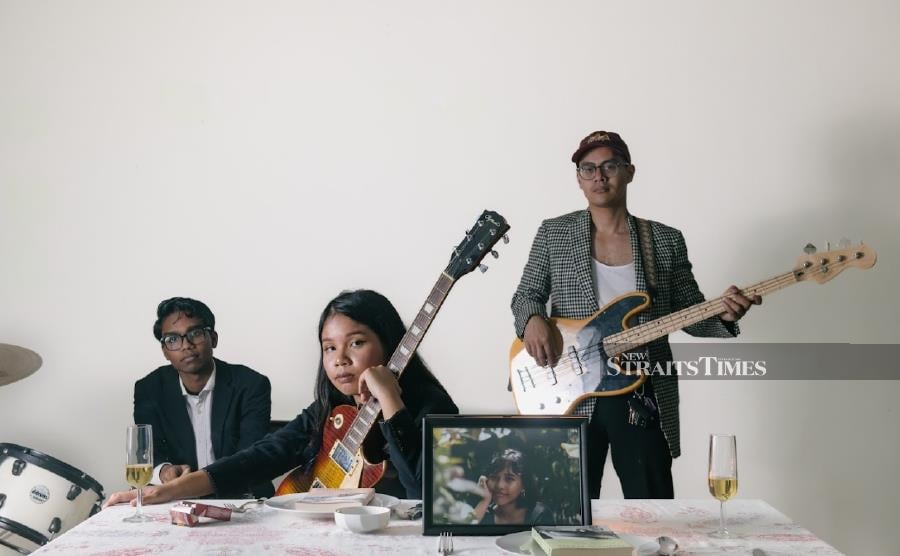 Alena with Isra and Azim (right) in the music video for Siren (photo courtesy of Alena Nadia)
