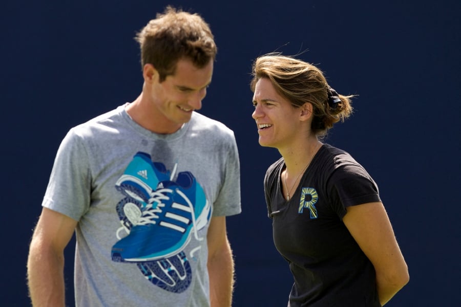 Andy Murray (left) trains as his coach Amelie Mauresmo looks on during a practice session on June 11, 2014. - AFP PIC