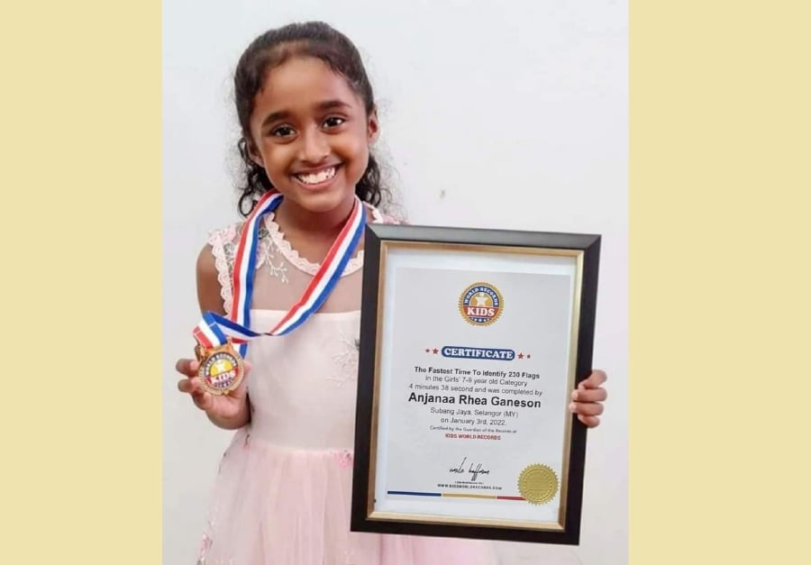 Anjanaa Rhea Ganeson, a Year Two student at SK Seri Selangor in Subang Jaya holds the Kids World Record, as well as the Jackhi Book of World Records for identifying 230 country flags in four minutes and 38 seconds. - Courtesy pic