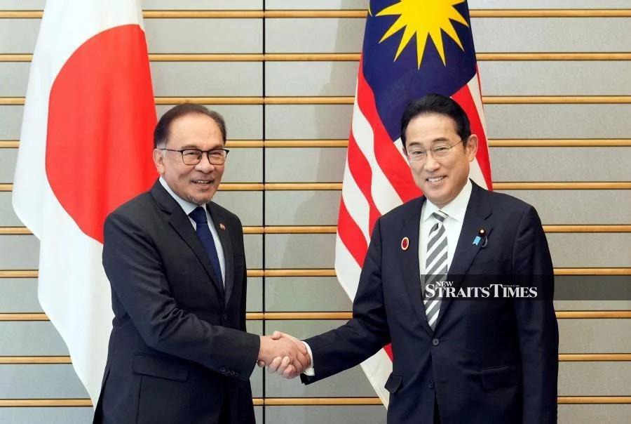 Prime Minister Datuk Seri Anwar Ibrahim shaking hands with Japanese Prime Minister Fumio Kishida at the previous Malaysia-Japan bilateral meeting in Tokyo, Japan, in December, 2023.- REUTERS/FRANCK ROBICHON
