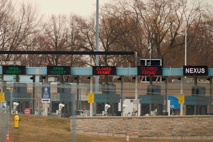 Signs show which lanes are open at Canada Customs in Sarnia Ontario. - AFP pic