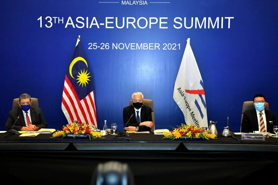  Prime Minister Datuk Seri Ismail Sabri Yaakob attending the opening of the 13th Asia-Europe Meeting (ASEM) Summit 2021 virtual meeting. Also present is Foreign Minister Datuk Saifuddin Abdullah (left). - BERNAMA PIC