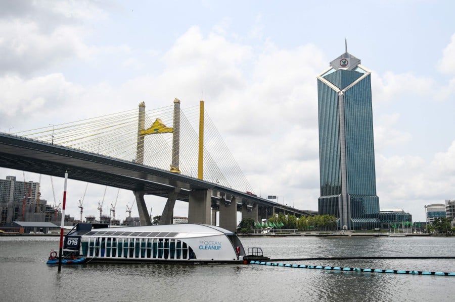 The Ocean Cleanup's Interceptor which captures floating plastic and trash before it reaches the ocean is seen during a press visit on the Chao Phraya river in Bangkok on March 26, 2024. -- Pic: AFP