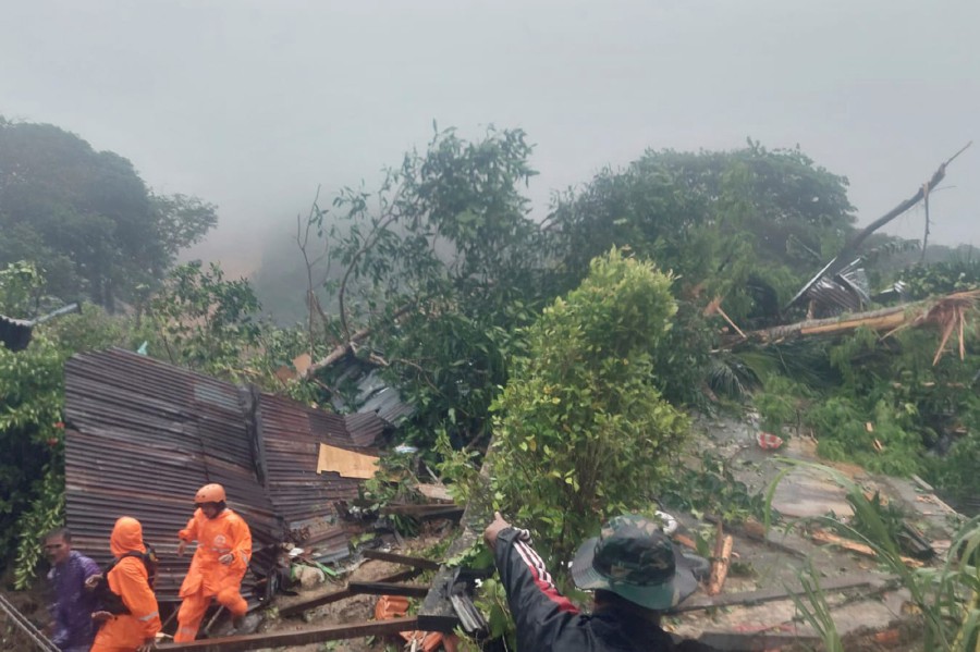 Rescuers search for victims at the site where a landslide hit a village on Serasan Island, Natuna regency, Indonesia. - AP PIC