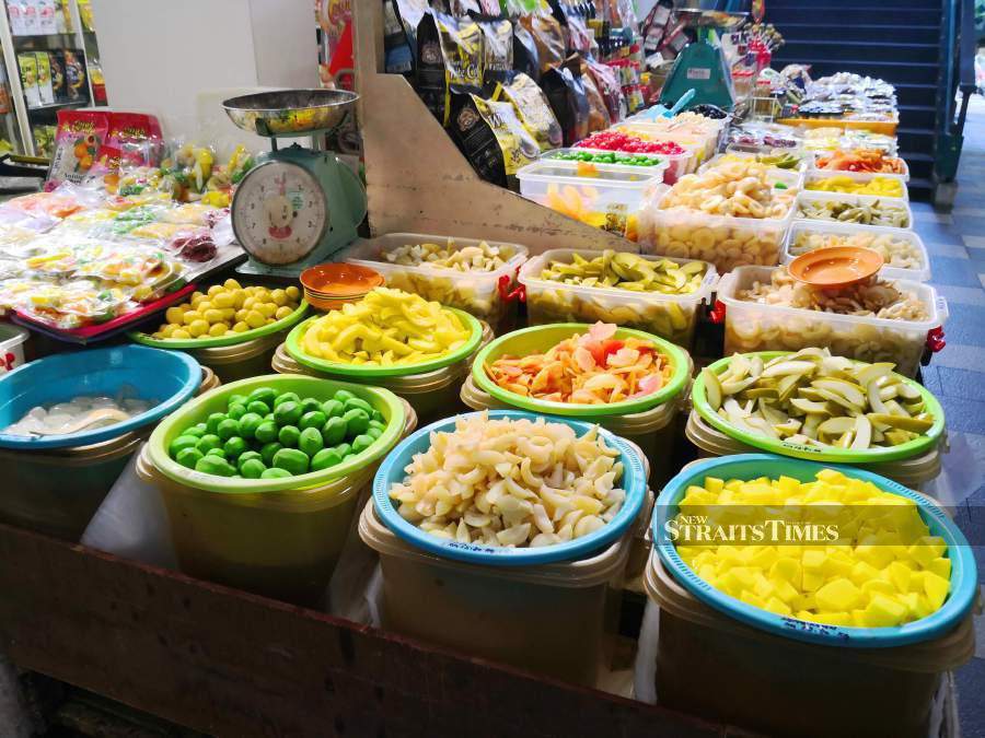 Sample the wide variety of pickled fruits before deciding which ones to buy.