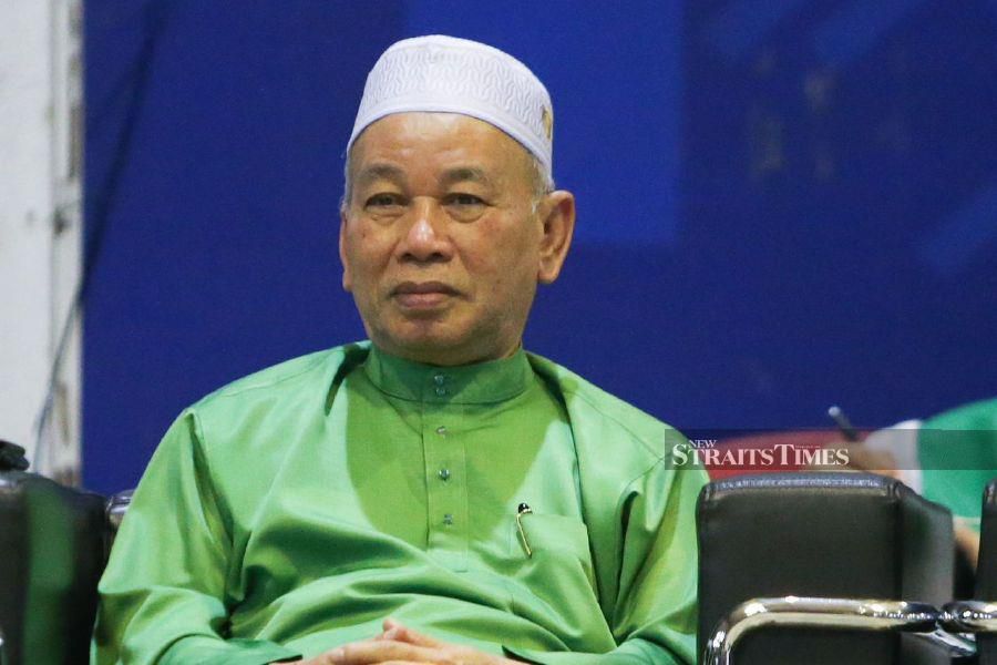 Caretaker State Works, Infrastructure, Transport and Utilities Committee chairman Datuk Azami Mohd Nor listens to the ceramah in Padang Kala. -NSTP/NIK ABDULLAH NIK OMAR