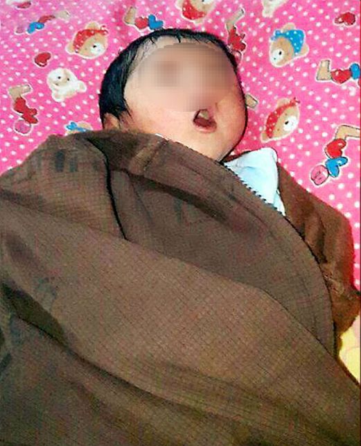 A baby girl was found on the doorstep of a home next to a mosque in Teluk Kumbar. Pix by NST reader