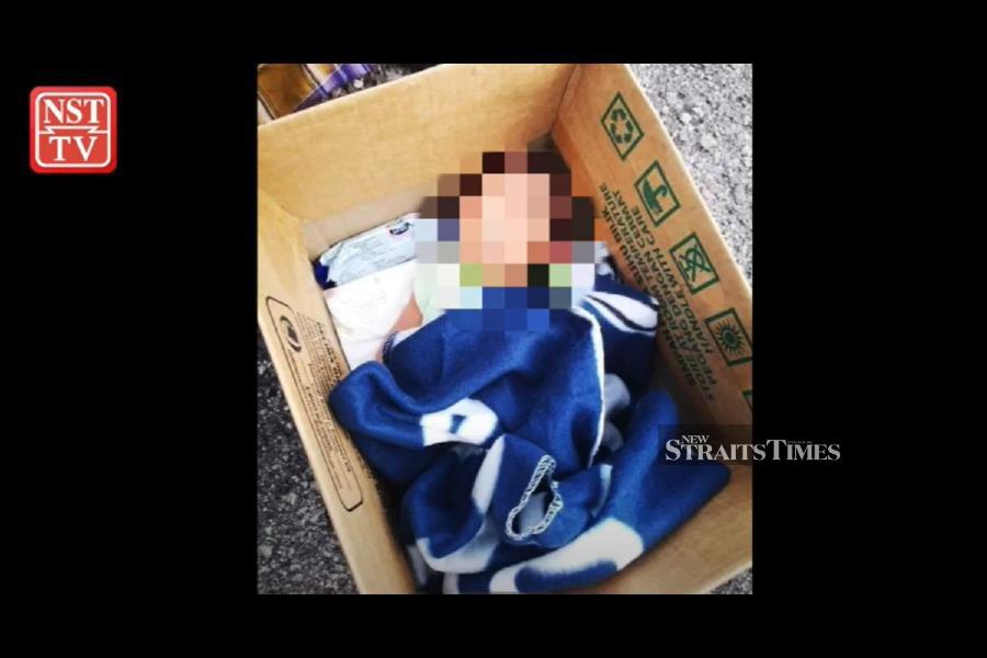 A video of a baby boy found in a box with a note in front of a surau on Sunday morning has gone viral, with many expressing their sympathy and concern for the infant. - NSTP pic