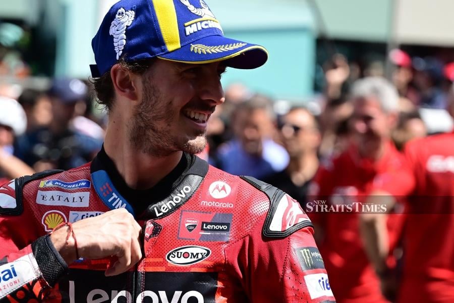 Ducati’s Francesco Bagnaia celebrates during the podium ceremony after winning the Sprint event of the Italian MotoGP race at Mugello today. - AFP PIC
