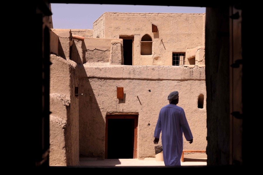 A man walks in Bahla Fort, one of four historical forts located at the foot of the Green Mountain highlands in Oman, and the only fort in the country designated a UNESCO Heritage Site, in Bahla. - AFP PIC