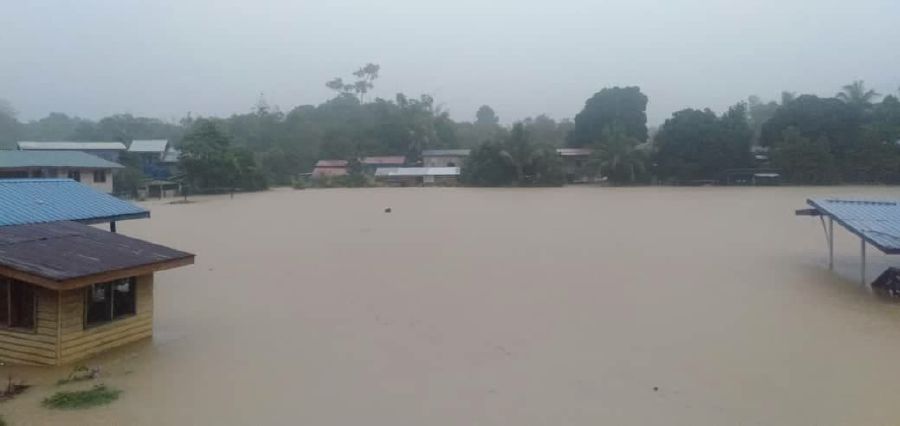 Fifteen villagers in Paitan were trapped after floods cut off access to most roads leading in and out of the area. - NSTP/ courtesy JON KILING