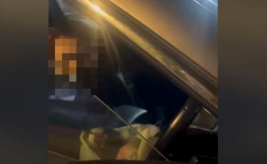 A woman alleged of begging alms was seen driving an imported car in a video that lasted just over two minutes and circulated on social media. - Screengrab via social media